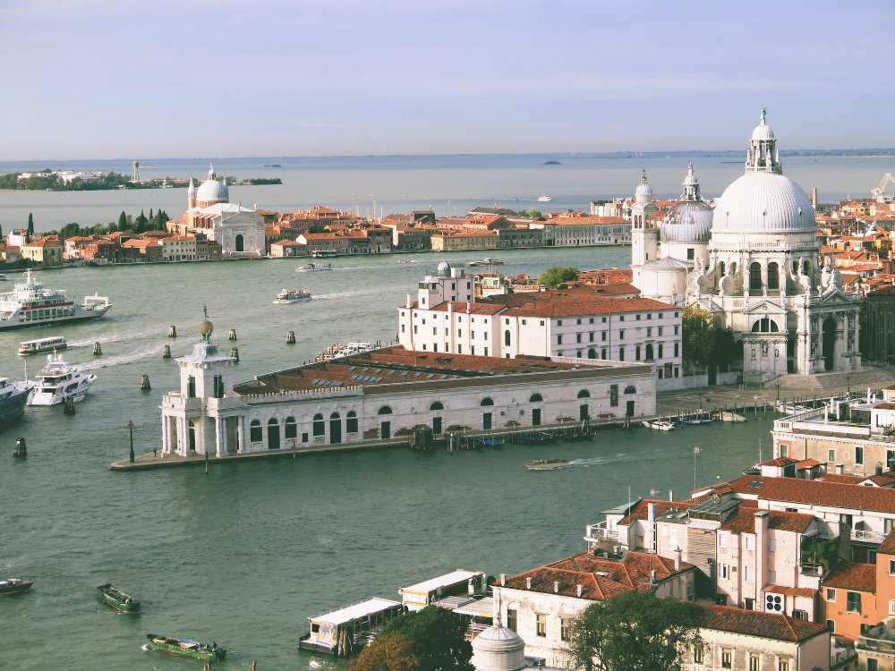 the view of santa maria della salute next to Punta della Dogana (Karen Uppal on Unsplash)